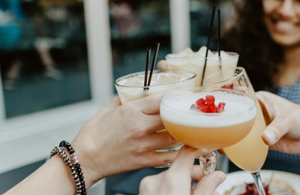 A picture of a toast of brunch cocktails in Rhode Island. 