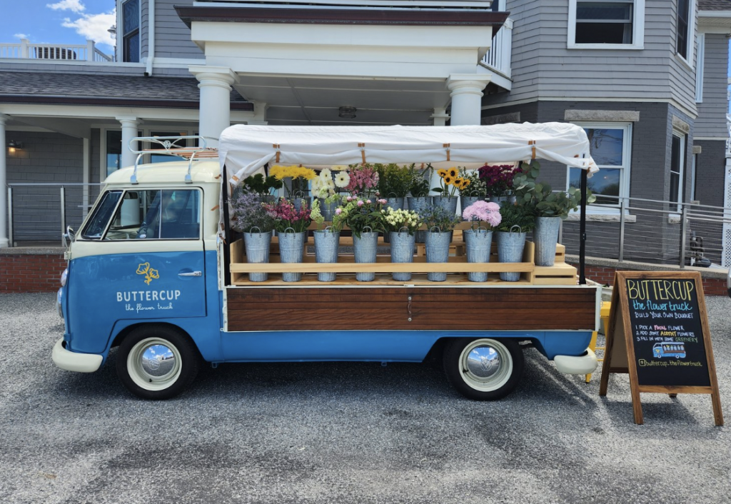 A photo of a VW bus turned into a mobile flower shop.