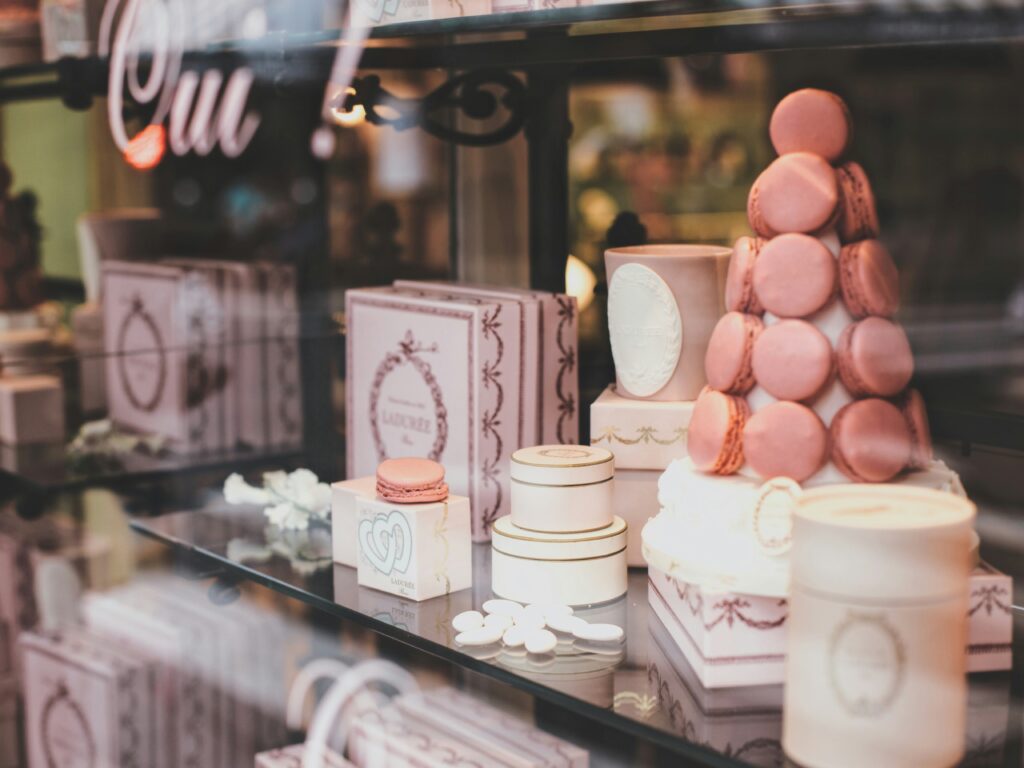 A photo of sweets and macaroons in a storefront.