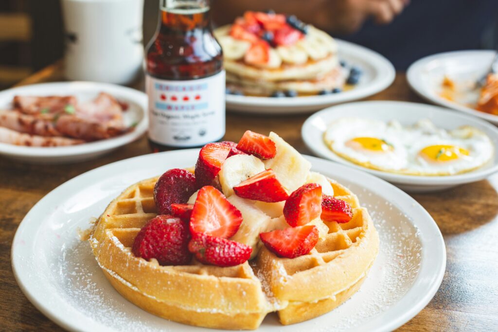 A brunch dish of Belgian waffles with fresh strawberries in Providence, Rhode Island.