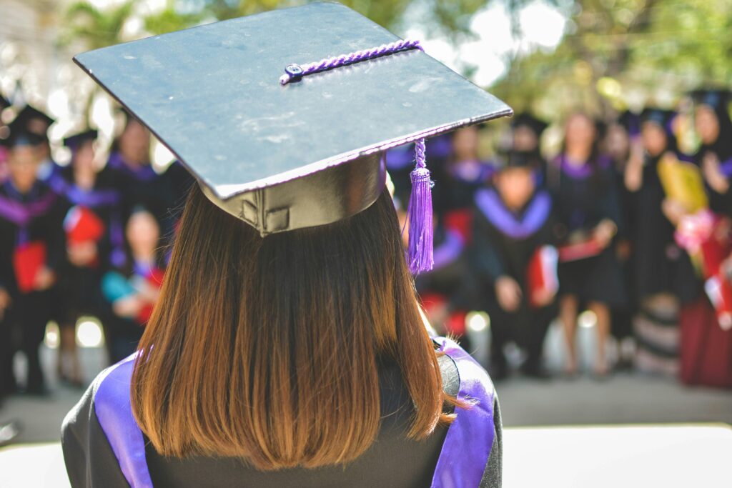 A girl graduating college in Newport, Rhode Island.