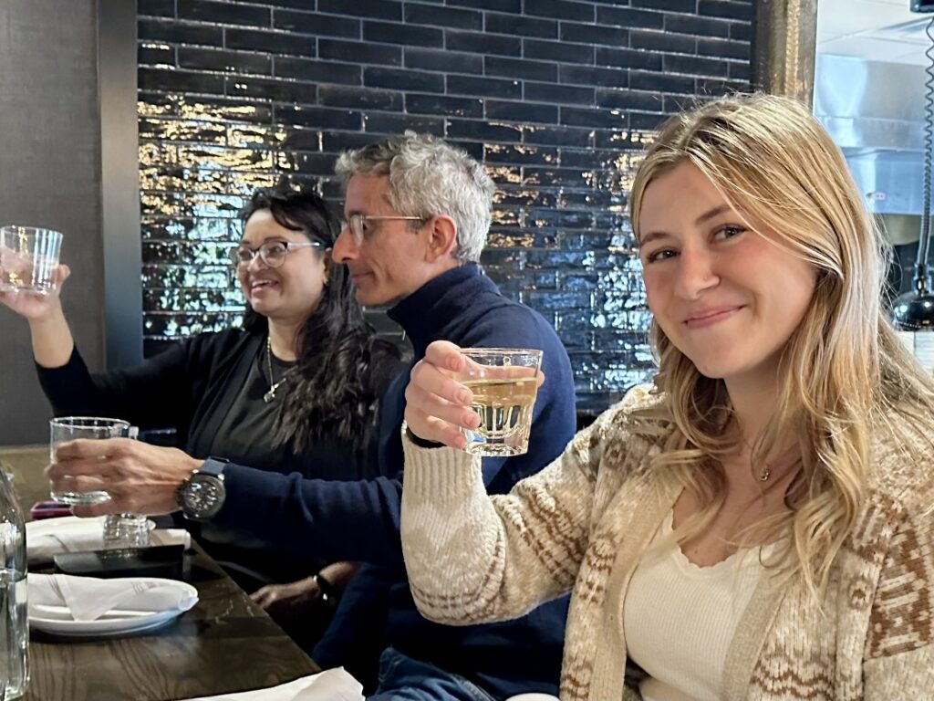 Girl raising a glass in a toast.